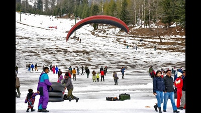 Tourists at the Solang Nala after fresh snowfall, in Manali, on Saturday. (PTI)