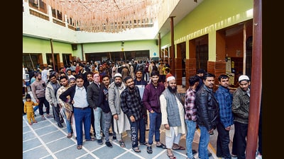 Voters wait in queues to cast their votes for the Delhi Assembly elections, at Mustafabad constituency. (ANI PHOTO) Voters wait in queues to cast their votes for the Delhi Assembly elections, at Mustafabad constituency. (ANI PHOTO)