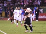 Inter Miami's Argentine forward Lionel Messi gives his jersey to Olimpia's Julian Martinez. Inter Miami's Argentine forward Lionel Messi gives his jersey to Olimpia's Julian Martinez.