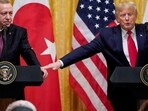 FILE PHOTO: U.S. President Donald Trump reaches to Turkey's President Tayyip Erdogan during a joint news conference at the White House in Washington, U.S., November 13, 2019. REUTERS/Joshua Roberts/File Photo/File Photo