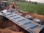 The accident site in Gujarat's Banaskantha where a dumper truck overturned, leaving four persons dead. The accident site in Gujarat's Banaskantha where a dumper truck overturned, leaving four persons dead.