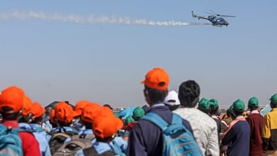 People gather to watch the final rehearsal of IAF aircrafts for Aero India 2025, at Yelahanka Air Force Station, in Bengaluru, Thursday, Feb. 6, 2025. (PTI) People gather to watch the final rehearsal of IAF aircrafts for Aero India 2025, at Yelahanka Air Force Station, in Bengaluru, Thursday, Feb. 6, 2025. (PTI)