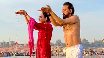 BJP MP Anurag Thakur with his wife Sheffali Thakur performs rituals while taking a holy dip during Mahakumbh, at Sangam in Prayagraj. (PTI) BJP MP Anurag Thakur with his wife Sheffali Thakur performs rituals while taking a holy dip during Mahakumbh, at Sangam in Prayagraj. (PTI)