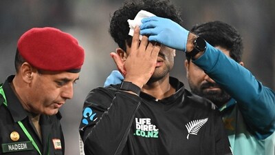 New Zealand's Rachin Ravindra (C) receives medical attention after being hit on the head by the ball during the Tri-Nation's first one-day international cricket match between Pakistan and New Zealand at the Gaddafi Stadium in Lahore on February 8 (AFP) New Zealand's Rachin Ravindra (C) receives medical attention after being hit on the head by the ball during the Tri-Nation's first one-day international cricket match between Pakistan and New Zealand at the Gaddafi Stadium in Lahore on February 8 (AFP)