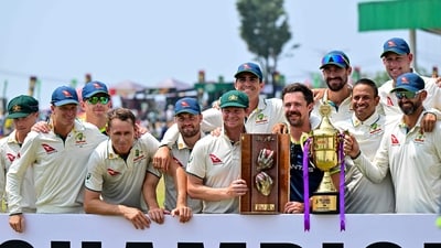 Australia's players pose with the trophies after their win at the end of the second Test cricket match. (AFP) Australia's players pose with the trophies after their win at the end of the second Test cricket match. (AFP)