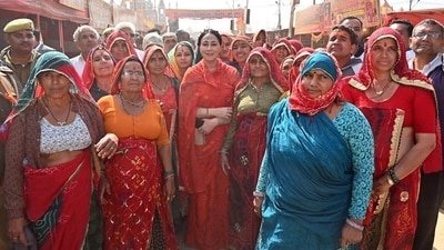 Rajasthan Deputy Chief Minister Diya Kumari in a group picture with women devotees at Triveni Sangam during the ongoing 'MahaKumbh', in Prayagraj on Sunday. ((ANI Photo)) Rajasthan Deputy Chief Minister Diya Kumari in a group picture with women devotees at Triveni Sangam during the ongoing 'MahaKumbh', in Prayagraj on Sunday. ((ANI Photo))
