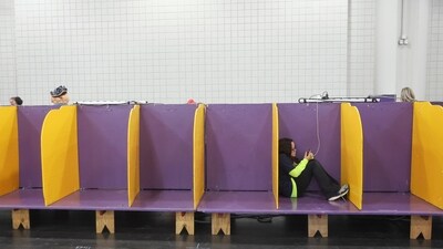 People utilize the empty demo ring benching area for dogs at the 149th Westminster Kennel Club Dog show in New York. (AP Photo/Heather Khalifa) People utilize the empty demo ring benching area for dogs at the 149th Westminster Kennel Club Dog show in New York. (AP Photo/Heather Khalifa)