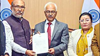 Manipur chief minister N Biren Singh (left)hands over his resignation letter to Governor Ajay Kumar Bhalla (middle), at the Raj Bhavan in Imphal on Sunday. (ANI) Manipur chief minister N Biren Singh (left)hands over his resignation letter to Governor Ajay Kumar Bhalla (middle), at the Raj Bhavan in Imphal on Sunday. (ANI)