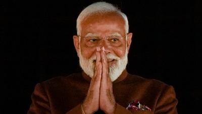 Prime Minister Narendra Modi gestures during celebrations at the BJP headquarters after the party won the Delhi assembly election on Saturday, (PTI)