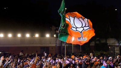 BJP workers gather to celebrate the party's win in the Delhi assembly election at the party headquarters in New Delhi on Saturday. (PTI) BJP workers gather to celebrate the party's win in the Delhi assembly election at the party headquarters in New Delhi on Saturday. (PTI)