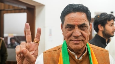 Newly elected MLA Mohan Singh Bisht flashes victory sign before a meeting after the victory in Delhi Assembly elections, at the Delhi state office in New Delhi, Sunday. (PTI) Newly elected MLA Mohan Singh Bisht flashes victory sign before a meeting after the victory in Delhi Assembly elections, at the Delhi state office in New Delhi, Sunday. (PTI)