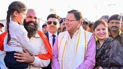 Uttarakhand Chief Minister Pushkar Singh Dhami with devotees at Uttarakhand Mandapam during the ongoing ‘Maha Kumbh’ mela in Prayagraj on Sunday. (ANI) Uttarakhand Chief Minister Pushkar Singh Dhami with devotees at Uttarakhand Mandapam during the ongoing ‘Maha Kumbh’ mela in Prayagraj on Sunday. (ANI)