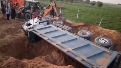 The accident site in Gujarat's Banaskantha where a dumper truck overturned, leaving four persons dead. (PTI) The accident site in Gujarat's Banaskantha where a dumper truck overturned, leaving four persons dead. (PTI)