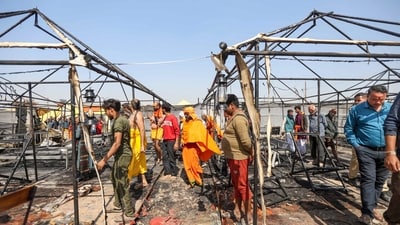 Prayagraj: People gather at the site after a fire broke out at a camp during the ongoing Maha Kumbh Mela 2025, in Prayagraj. (PTI) Prayagraj: People gather at the site after a fire broke out at a camp during the ongoing Maha Kumbh Mela 2025, in Prayagraj. (PTI)