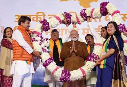 Prime Minister Narendra Modi being garlanded during celebrations at the BJP HQ after the party won the Delhi assembly election in New Delhi on Saturday, (narendramodi.in)