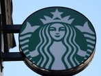 To claim free coffee, Starbucks Rewards members must use a coupon in-store or through the app on February 10.
REUTERS/Hollie Adams/File Photo