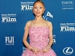 Ariana Grande advocates for mental health services for young stars, urging studios to integrate therapy into contracts.  Kevin Winter/Getty Images/AFP (Photo by KEVIN WINTER / GETTY IMAGES NORTH AMERICA / Getty Images via AFP)