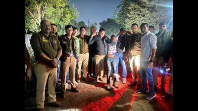 Accused in police custody after an encounter in Agra. (HT ) Accused in police custody after an encounter in Agra. (HT )