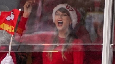 Taylor Swift donned a chic winter red and white ensemble for the Kansas City Chiefs and Las Vegas Raiders game at GEHA Field at Arrowhead Stadium on Dec 25, 2023 (USA TODAY Sports via Reuters Con)