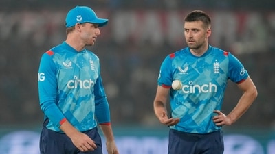 England's captain Jos Buttler, left, talks to Mark Wood during the second one day international cricket match between India and England in Cuttack. (AP) England's captain Jos Buttler, left, talks to Mark Wood during the second one day international cricket match between India and England in Cuttack. (AP)