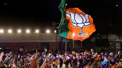 BJP workers gather to celebrate the party's win in the Delhi assembly election at the party headquarters in New Delhi on Saturday. (PTI) BJP workers gather to celebrate the party's win in the Delhi assembly election at the party headquarters in New Delhi on Saturday. (PTI)