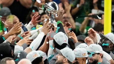 Philadelphia Eagles players holds the Vince Lombardi Trophy after the NFL Super Bowl 59 football game against the Kansas City Chiefs, Sunday, Feb. 9, 2025, in New Orleans. (AP) Philadelphia Eagles players holds the Vince Lombardi Trophy after the NFL Super Bowl 59 football game against the Kansas City Chiefs, Sunday, Feb. 9, 2025, in New Orleans. (AP)