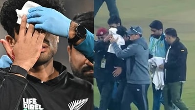 New Zealand's Rachin Ravindra (C) receives medical attention after being hit on the head by the ball during the Tri-Nation's first one-day international cricket match between Pakistan and New Zealand