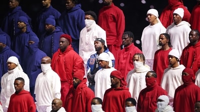 Troupes of dancers dressed in red, white and blue at one point coalesced into an American flag formation. (Getty Images via AFP) Troupes of dancers dressed in red, white and blue at one point coalesced into an American flag formation. (Getty Images via AFP)