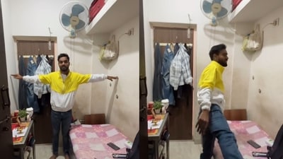 The man touches both walls simultaneously, highlighting the Bengaluru room's breadth. (Instagram/abhiskks_17) The man touches both walls simultaneously, highlighting the Bengaluru room's breadth. (Instagram/abhiskks_17)
