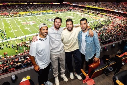 Lionel Messi (second from left) with friends and family