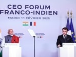 Indian Prime Minister Narendra Modi (L) delivers a speech next to French President Emmanuel Macron during the closing session of the Franco-Indian Economic Forum at the Quai d'Orsay following the Artificial Intelligence (AI) Action Summit in Paris, on February 11, 2025. (Photo by Abdul Saboor / POOL / AFP)