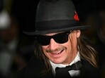 US singer Kid Rock does an interview with radio host Sean Hanity (off frame) as he arrives to the Commander-In-Chief inaugural ball at the Walter E. Washington Convention Center in Washington, DC, on January 20, 2025. (Photo by Patrick T. Fallon / AFP)