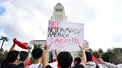 A person holds a sign in front of Los Angeles City Hall as hundreds of high school students participate in a protest entitled "A Day Without Immigrants" through downtown Los Angeles on February 4, 2025, against stepped up federal enforcement against illegal immigration. (AFP FILE ) A person holds a sign in front of Los Angeles City Hall as hundreds of high school students participate in a protest entitled "A Day Without Immigrants" through downtown Los Angeles on February 4, 2025, against stepped up federal enforcement against illegal immigration. (AFP FILE )