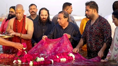 Reliance Industries Chairman Mukesh Ambani with family performs a ritual while taking a holy dip. Swami Kailashanand Giri ji Maharaj of Niranjani Akhara performed the Ganga Puja attended by the family. (PTI) Reliance Industries Chairman Mukesh Ambani with family performs a ritual while taking a holy dip. Swami Kailashanand Giri ji Maharaj of Niranjani Akhara performed the Ganga Puja attended by the family. (PTI)
