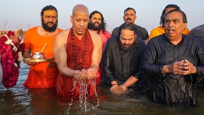 Following the prayer, Ambani met Swami Chiddanand Saraswati Maharaj of Parmarth Niketan Ashram, where the family distributed sweets and life jackets. (PTI) Following the prayer, Ambani met Swami Chiddanand Saraswati Maharaj of Parmarth Niketan Ashram, where the family distributed sweets and life jackets. (PTI)