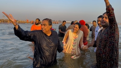 According to a release issued by Reliance Industries Limited, Ambani, along with his mother, Kokilaben, sons Akash and Anant, daughter-in-laws Shloka and Radhika, grandchildren Prithvi and Veda, and sisters Dipti Salgaocar and Nina Kothari took the dip. (AP) According to a release issued by Reliance Industries Limited, Ambani, along with his mother, Kokilaben, sons Akash and Anant, daughter-in-laws Shloka and Radhika, grandchildren Prithvi and Veda, and sisters Dipti Salgaocar and Nina Kothari took the dip. (AP)