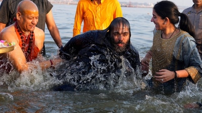Swami Kailashanand Saraswati helps Anant Ambani and Radhika Merchant to take ritualistic holy dip at Sangam the confluence of Rivers Ganges, Yamuna and mythical Saraswati, during the Mahakumbh festival. (AP) Swami Kailashanand Saraswati helps Anant Ambani and Radhika Merchant to take ritualistic holy dip at Sangam the confluence of Rivers Ganges, Yamuna and mythical Saraswati, during the Mahakumbh festival. (AP)