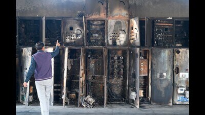 Engineers and technicians checking the burnt control panel at the 220 kV sub station in Sector-102 near Dwarka Expressway on Tuesday. (HT PHOTO) Engineers and technicians checking the burnt control panel at the 220 kV sub station in Sector-102 near Dwarka Expressway on Tuesday. (HT PHOTO)