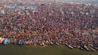 Devotees perform rituals at Sangam after taking a holy dip on the eve of 'Maghi Purnima' bath festival during ongoing Maha Kumbh Mela, in Prayagraj (PTI) Devotees perform rituals at Sangam after taking a holy dip on the eve of 'Maghi Purnima' bath festival during ongoing Maha Kumbh Mela, in Prayagraj (PTI)