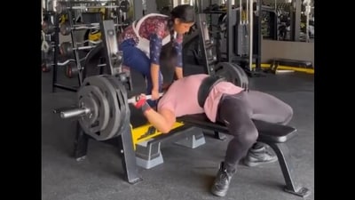 A bodybuilder's 165 kg bench press went wrong, trapping him under the barbell until a woman rescued him. (Instagram/villupurathu_master) A bodybuilder's 165 kg bench press went wrong, trapping him under the barbell until a woman rescued him. (Instagram/villupurathu_master)