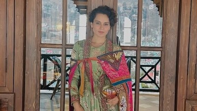 Kangana Ranaut poses in front of her Manali restaurant. Kangana Ranaut poses in front of her Manali restaurant.