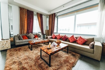 Rugs are not only functional but can also prove to be a decorative piece. Layering rugs can solve the woe of decoration. One can start with placing the bigger rug at the bottom and place smaller rugs on top of it. Colour blocking in contrast to the theme of the living room will help increase the aesthetic quotient of the living room. (Iamge by Naim Benjelloun) Rugs are not only functional but can also prove to be a decorative piece. Layering rugs can solve the woe of decoration. One can start with placing the bigger rug at the bottom and place smaller rugs on top of it. Colour blocking in contrast to the theme of the living room will help increase the aesthetic quotient of the living room. (Iamge by Naim Benjelloun)
