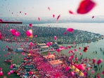 Prayagraj: In this image provided by CMO, flower petals being showered on devotees at the Sangam on the occasion of 'Maghi Purnima' during the ongoing Maha Kumbh Mela, in Prayagraj, Wednesday, Feb. 12, 2025.
