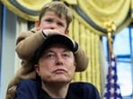 Elon Musk carries his son X AE A-XII on his shoulders in the Oval Office