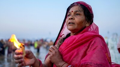 An Indian devotee prays to the Sun god at the Sangam, the confluence of rivers, the Ganges, the Yamuna and the mythical Saraswati, on Maghi Purnima or the full-moon day during the Maha Kumbh festival, in Prayagraj. (AP) An Indian devotee prays to the Sun god at the Sangam, the confluence of rivers, the Ganges, the Yamuna and the mythical Saraswati, on Maghi Purnima or the full-moon day during the Maha Kumbh festival, in Prayagraj. (AP)