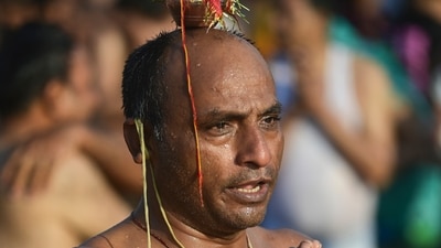 Prayagraj: A devotee prays after taking a holy dip at Triveni Sangam on the occasion on Maghi Purnima. (PTI) Prayagraj: A devotee prays after taking a holy dip at Triveni Sangam on the occasion on Maghi Purnima. (PTI)