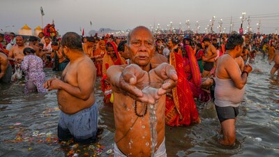 Devotees perform rituals while taking a holy dip on ‘Maghi Purnima’. Over 2 crore people took a holy dip at the Triveni Sangam on Wednesday. (PTI) Devotees perform rituals while taking a holy dip on ‘Maghi Purnima’. Over 2 crore people took a holy dip at the Triveni Sangam on Wednesday. (PTI)