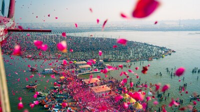 Prayagraj: In this image provided by CMO, flower petals being showered on devotees at the Sangam on the occasion of 'Maghi Purnima' during the ongoing Maha Kumbh Mela, in Prayagraj, Wednesday, Feb. 12, 2025. (PTI) Prayagraj: In this image provided by CMO, flower petals being showered on devotees at the Sangam on the occasion of 'Maghi Purnima' during the ongoing Maha Kumbh Mela, in Prayagraj, Wednesday, Feb. 12, 2025. (PTI)