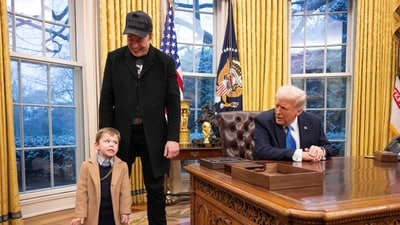 US President Donald Trump speaks to Elon Musk's son X � A-Xii in the Oval Office of the White House in Washington, DC, on February 11, 2025. Tech billionaire Elon Musk, who has been tapped by President Donald Trump to lead federal cost-cutting efforts, said the United States would go "bankrupt" without budget cuts. Musk leads the efforts under the newly created Department of Government Efficiency (DOGE), and was speaking at the White House with Trump, who has in recent weeks unleashed a flurry of orders aimed at slashing federal spending. (Photo by Jim WATSON / AFP) (AFP) US President Donald Trump speaks to Elon Musk's son X � A-Xii in the Oval Office of the White House in Washington, DC, on February 11, 2025. Tech billionaire Elon Musk, who has been tapped by President Donald Trump to lead federal cost-cutting efforts, said the United States would go "bankrupt" without budget cuts. Musk leads the efforts under the newly created Department of Government Efficiency (DOGE), and was speaking at the White House with Trump, who has in recent weeks unleashed a flurry of orders aimed at slashing federal spending. (Photo by Jim WATSON / AFP) (AFP)