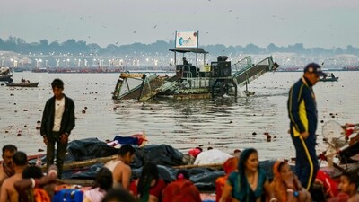 A worker collects waste using a trash skimmer machine across Sangam, the confluence of Ganges, Yamuna and mythical Saraswati rivers, on the occasion of Maghi Purnima during the Maha Kumbh Mela festival in Prayagraj. (AFP) A worker collects waste using a trash skimmer machine across Sangam, the confluence of Ganges, Yamuna and mythical Saraswati rivers, on the occasion of Maghi Purnima during the Maha Kumbh Mela festival in Prayagraj. (AFP)